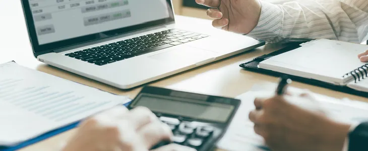 An accountant helping client with taxes
