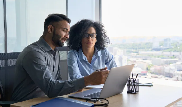 Man and woman going over taxes